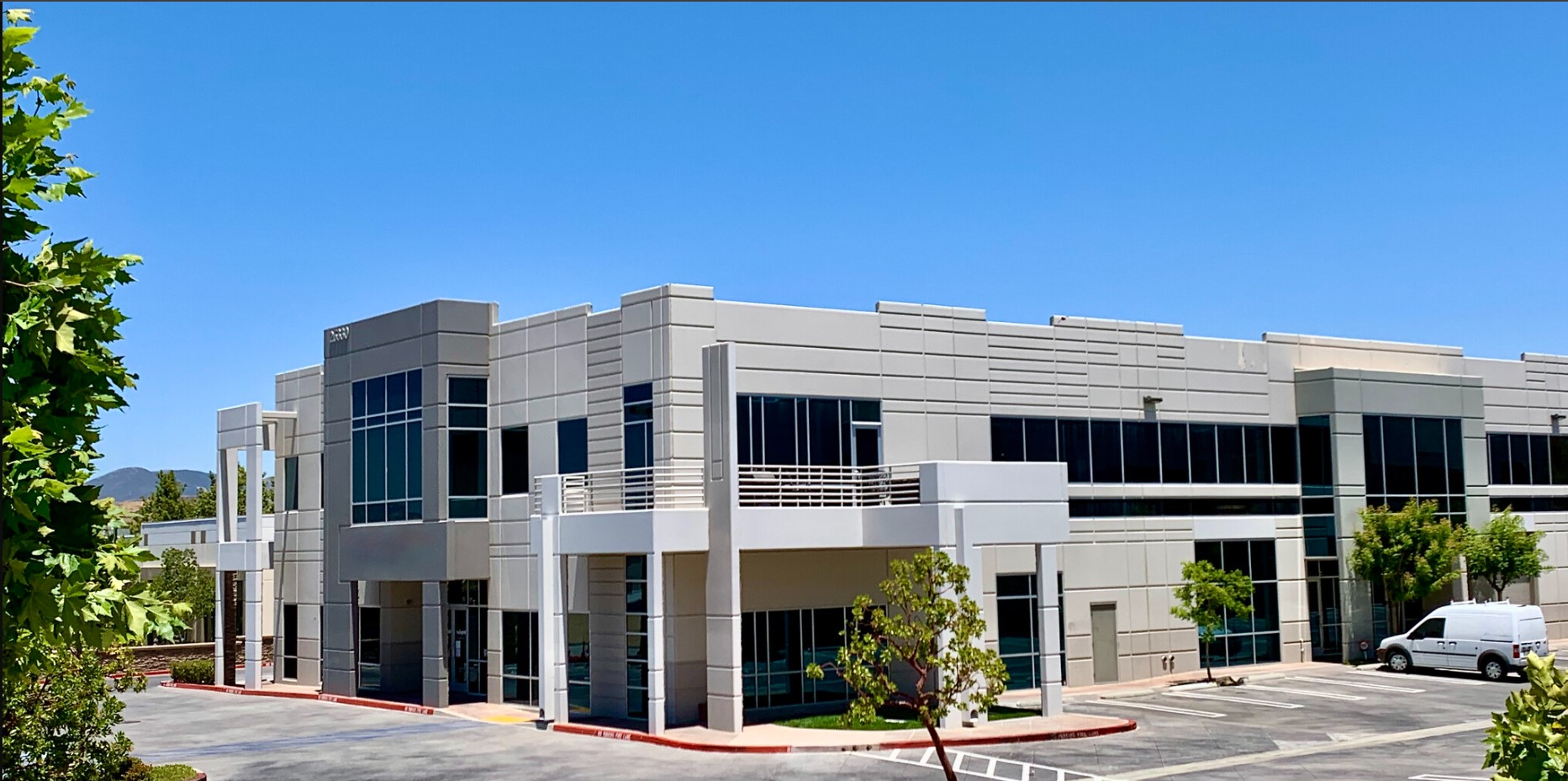  Exterior view of a contemporary two-story building with large windows, housing the Insight Treatment Programs in Santa Clarita.