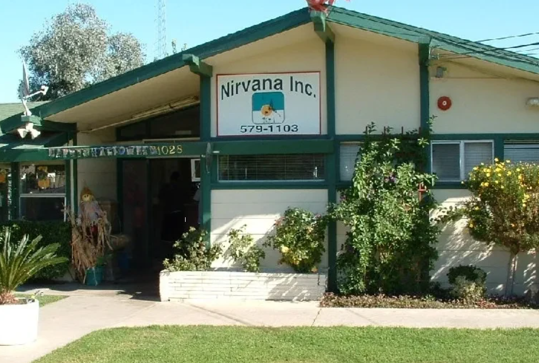 Rehab center exterior with green trim and garden