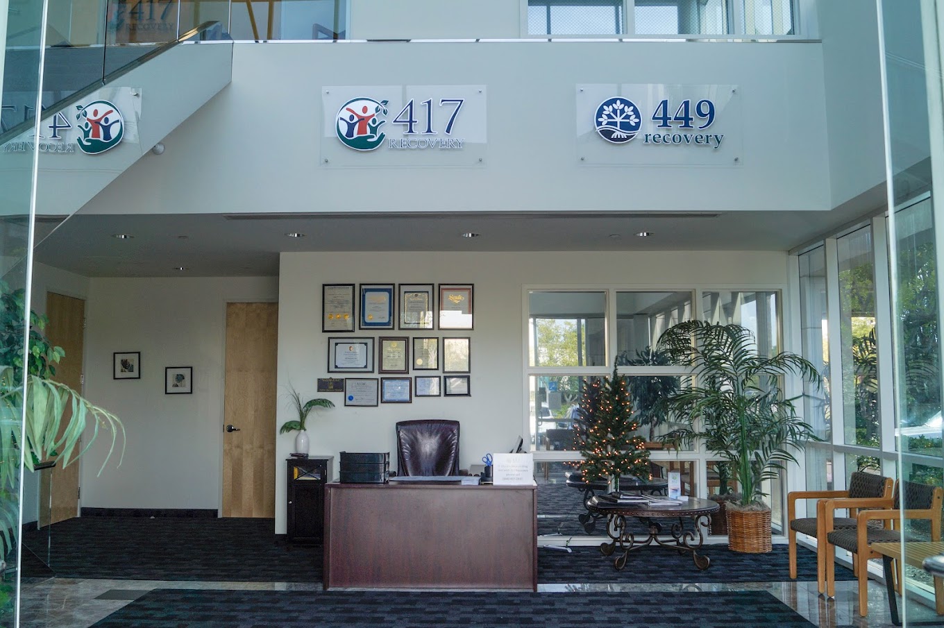 Reception area with a desk and seating.
