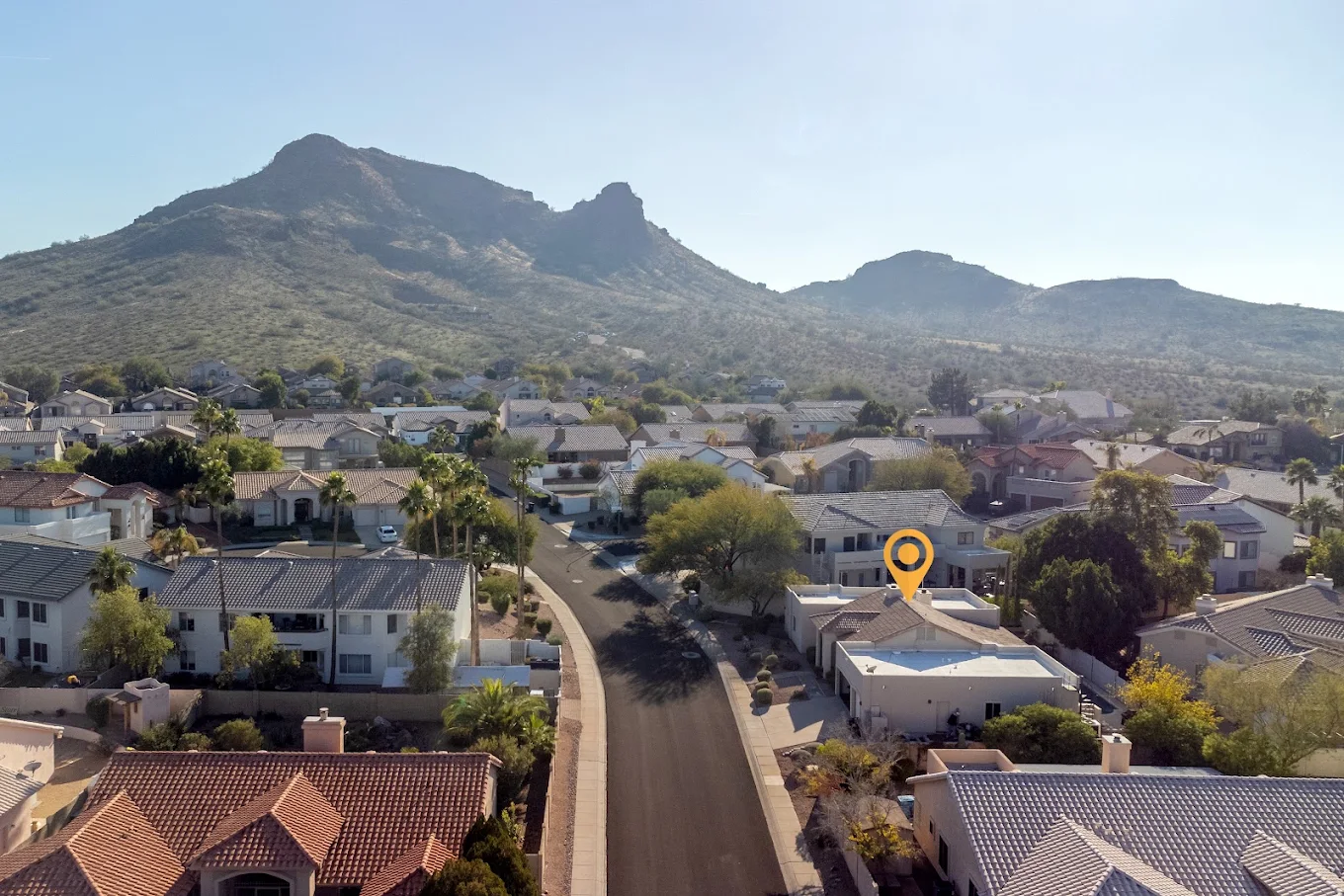 Aerial view of the facility neighborhood near desert mountains