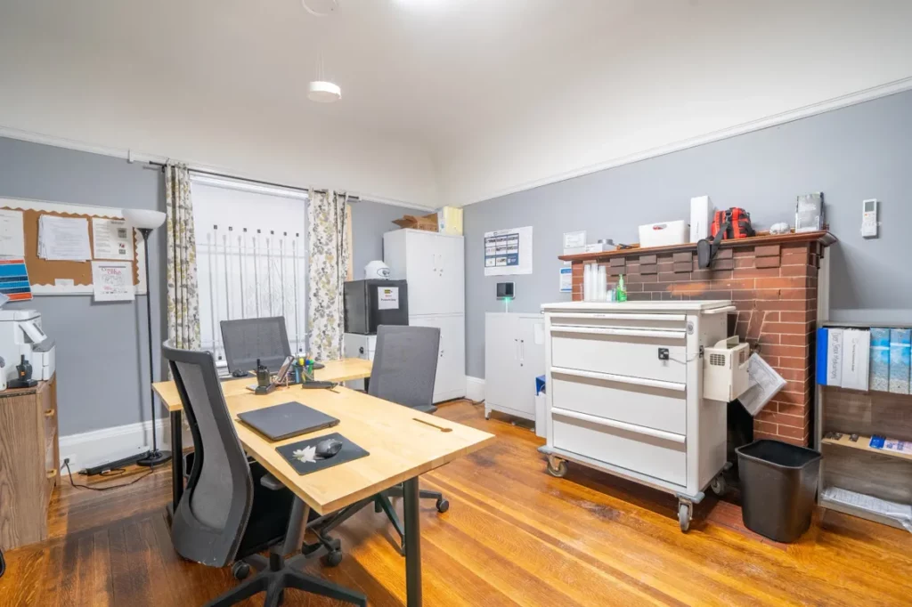 Counseling office with desks and clinical workspace