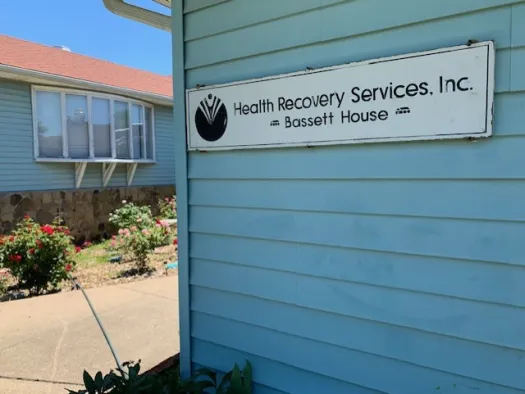 Building exterior with Health Recovery Services Bassett House sign