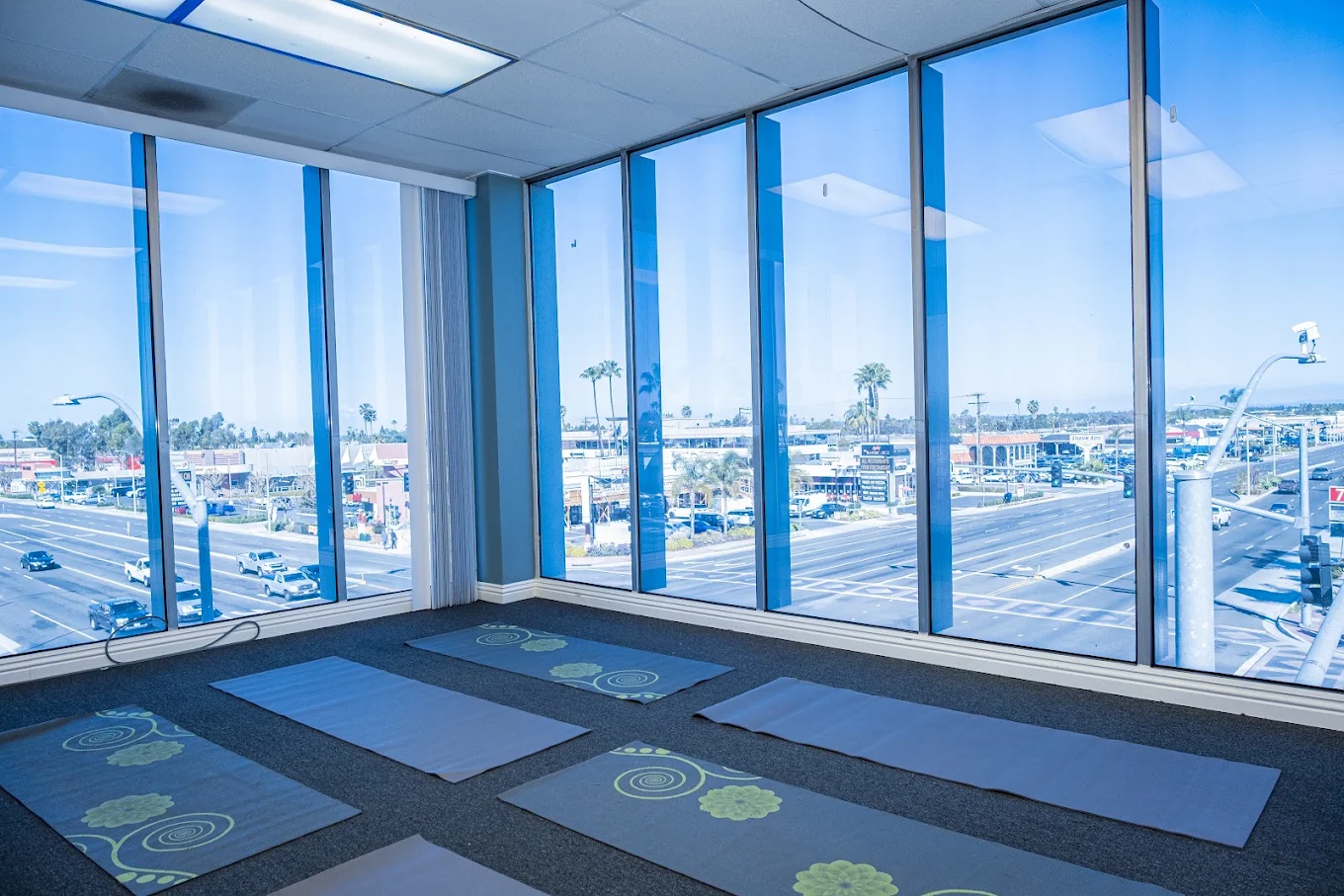Wellness room with yoga mats overlooking the marina