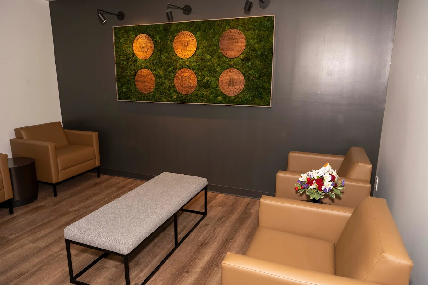 Comfortable lounge with armchairs and military emblems