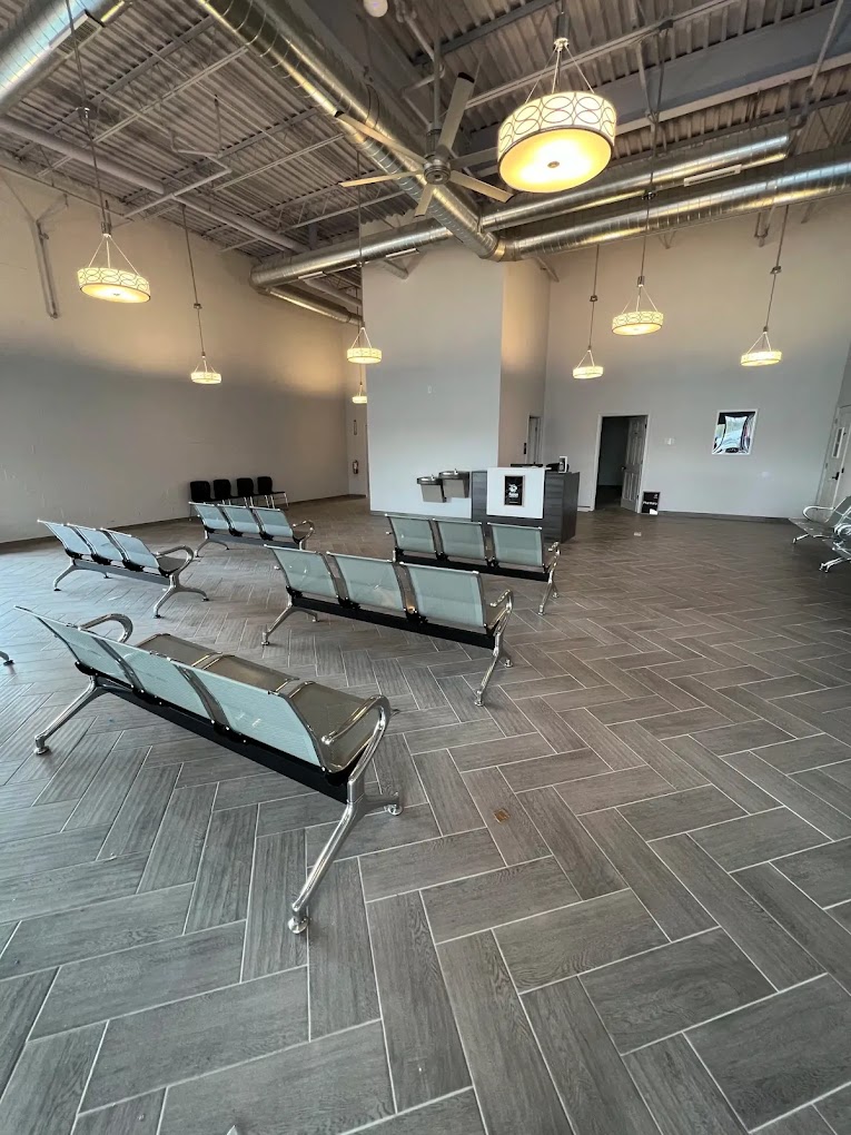 A spacious waiting area with modern seating and high ceilings.