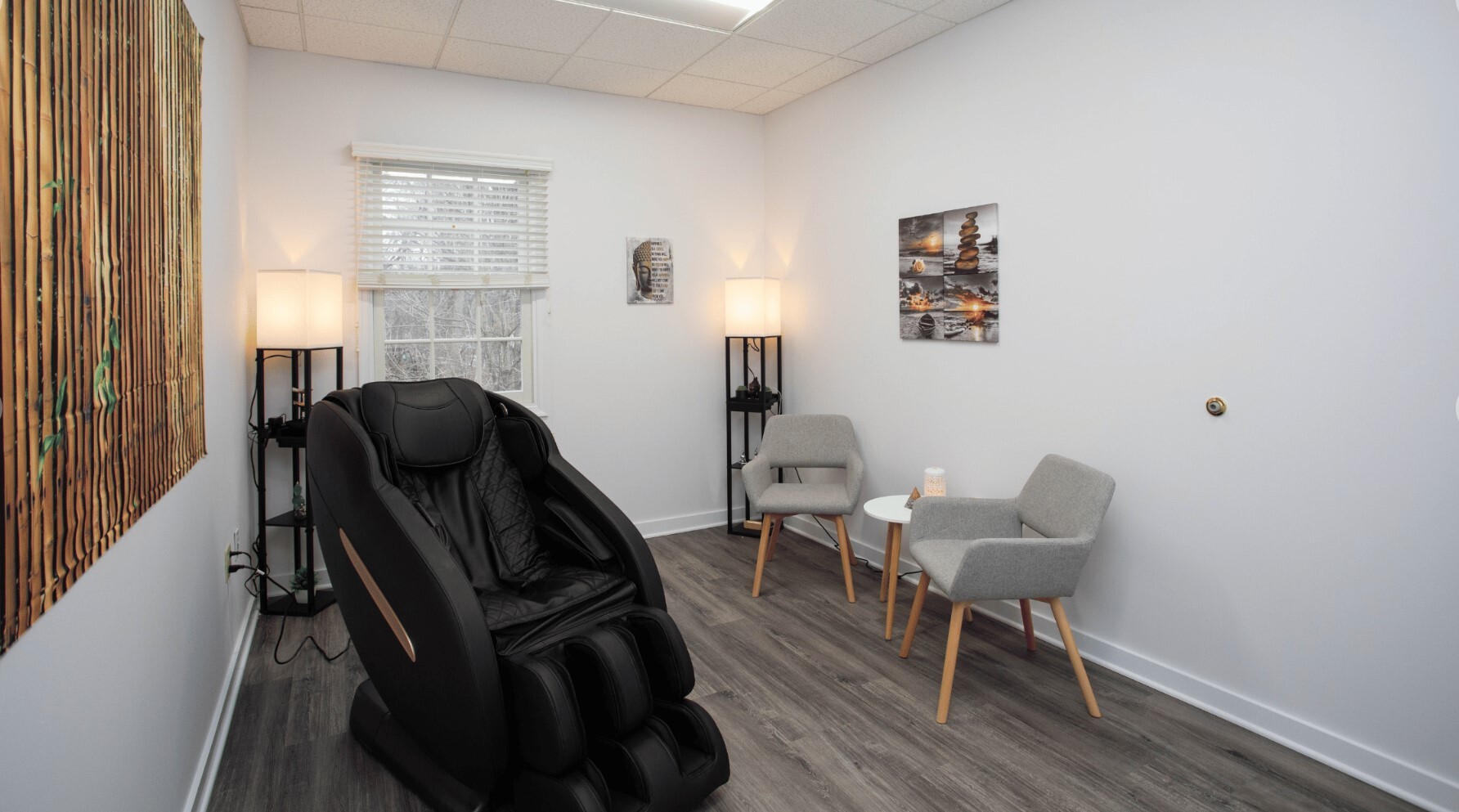 Therapy room with massage chair and decor.