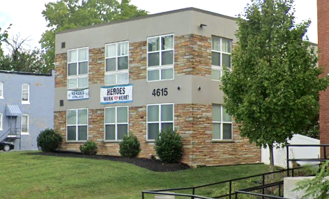 Side view of Gaudenzia Inc. building with stone facade and entrance ramp.