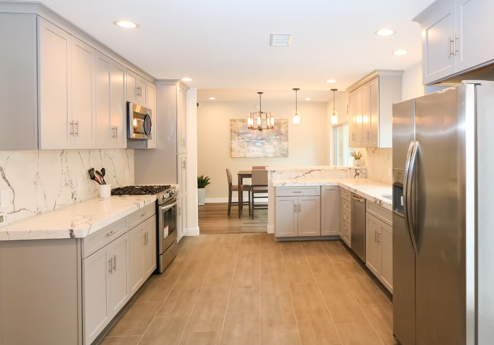 Kitchen with marble counters and stainless appliances
