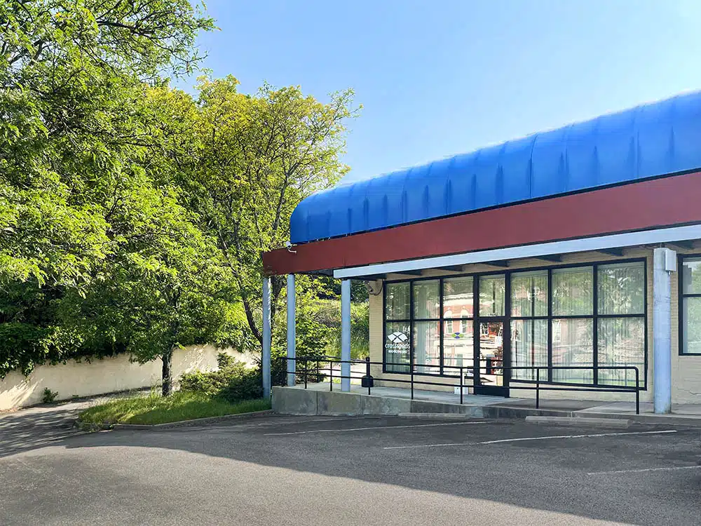 Clinic exterior with parking lot and accessible ramp entrance