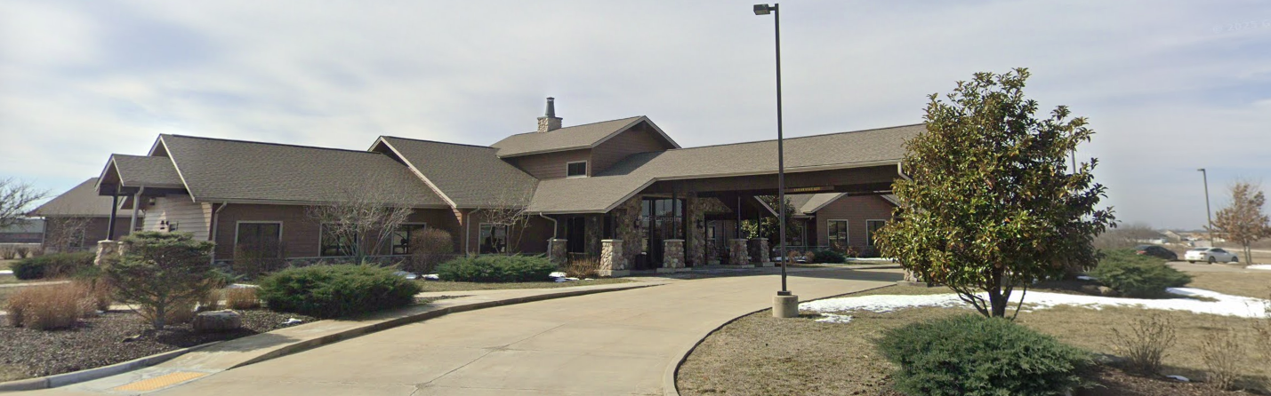 Rehab center exterior surrounded by trees and driveway