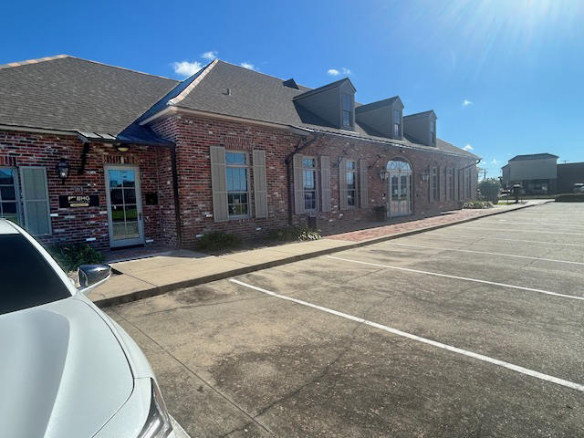 Angled view of brick treatment center and parking lot