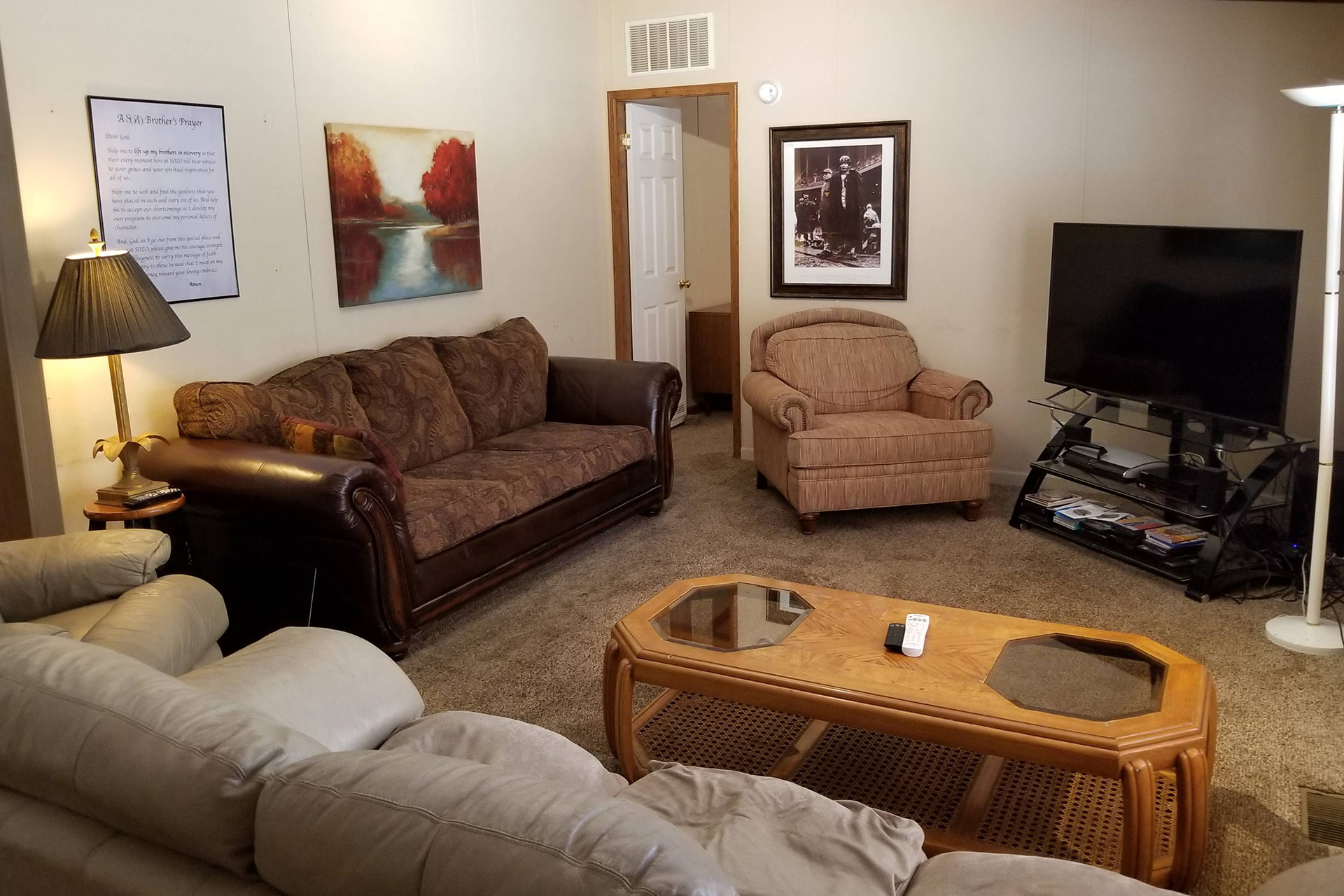 Comfortable group lounge with sofas and television