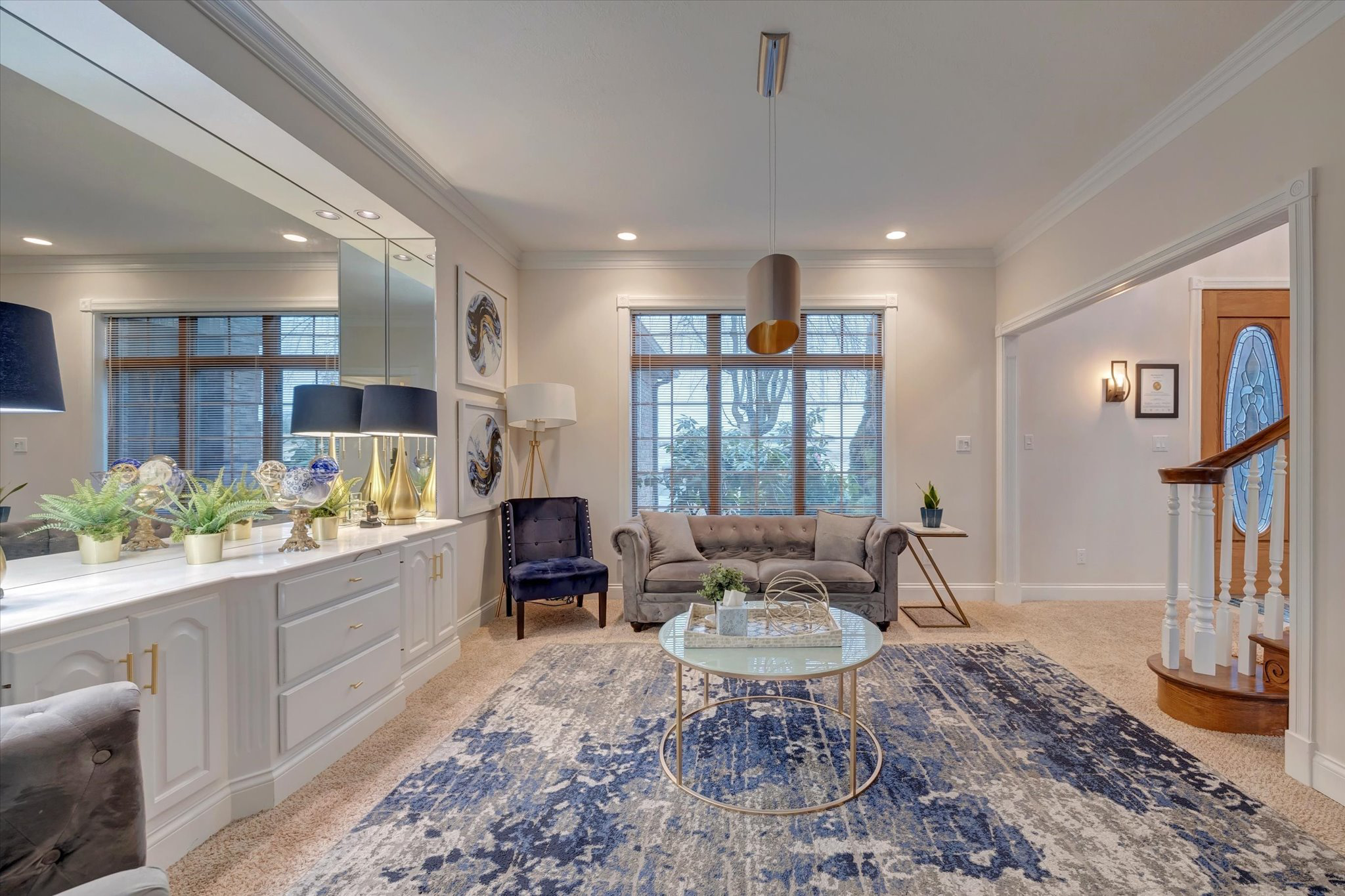 Relaxing lounge with seating, mirrors, and soft lighting