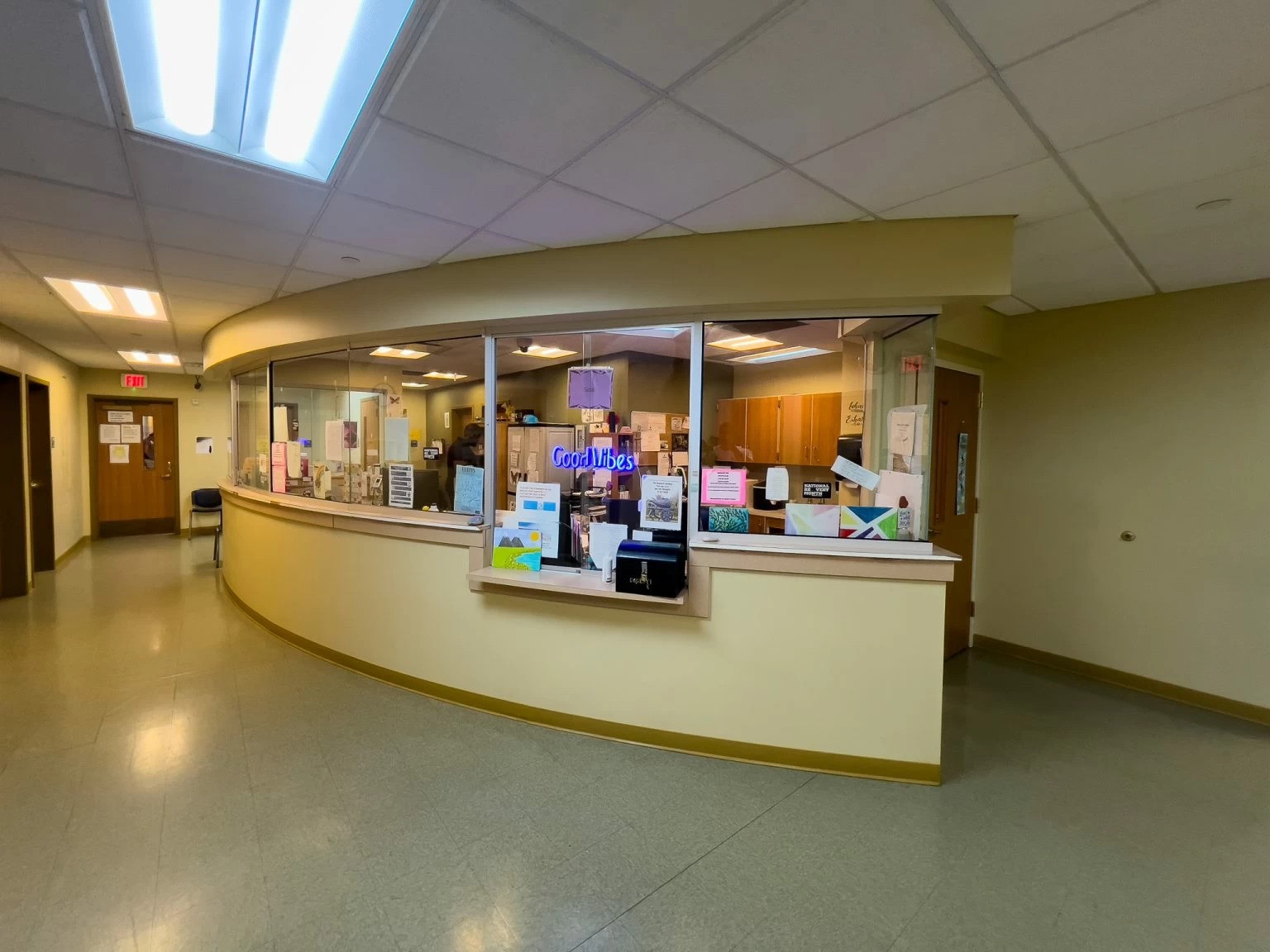 Front desk area with bulletin boards and counter