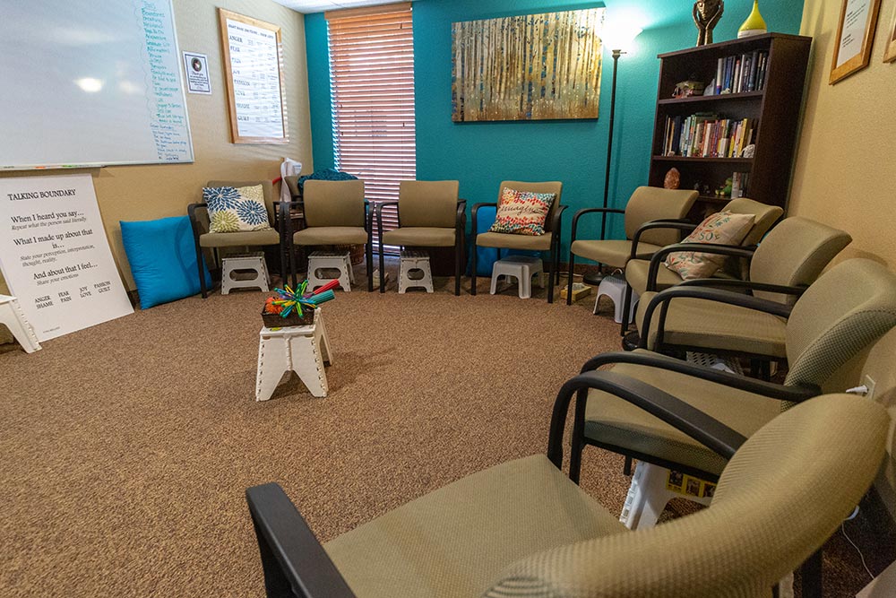 Group therapy room with chairs arranged in a circle