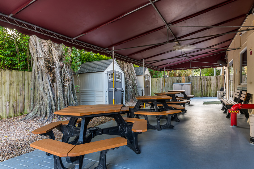 Outdoor area with tables and benches.