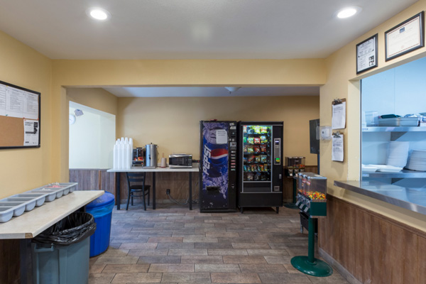 Pantry area with vending machines and snack counter