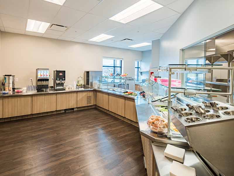 Food service area with beverage station and salad bar