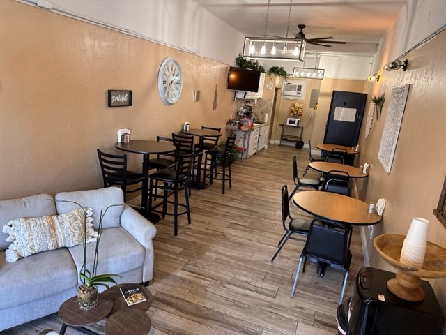 Coffee lounge with tables, chairs, and snack bar