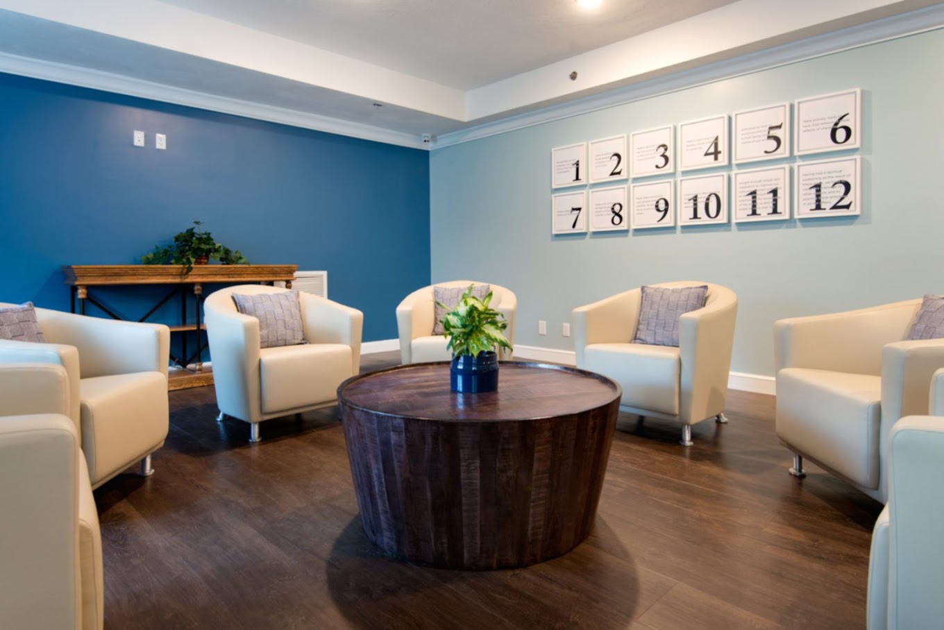 Group therapy room with chairs arranged around a table.