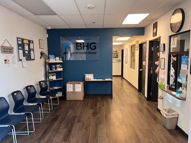 Lobby with waiting chairs and BHG wall sign