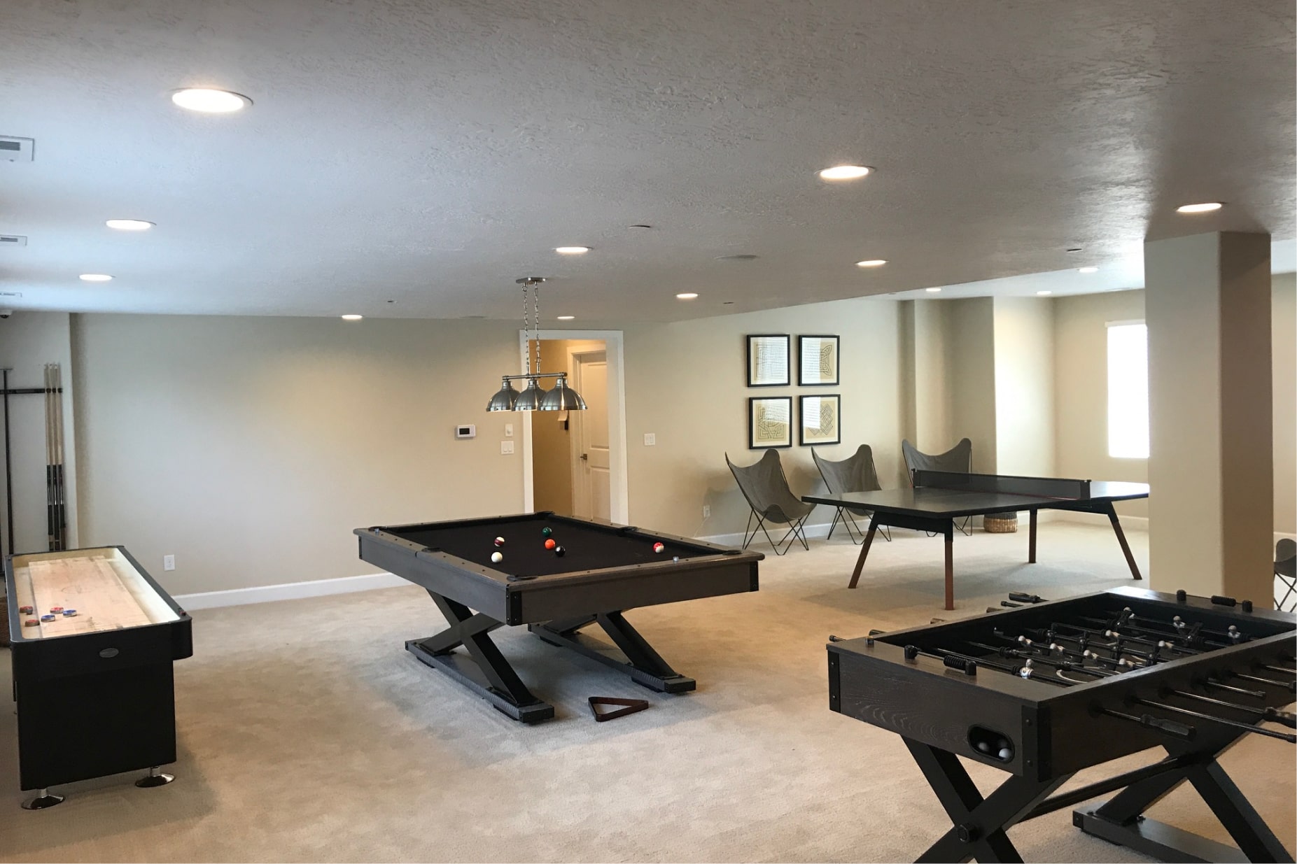 Recreation room with pool, foosball, and ping pong tables