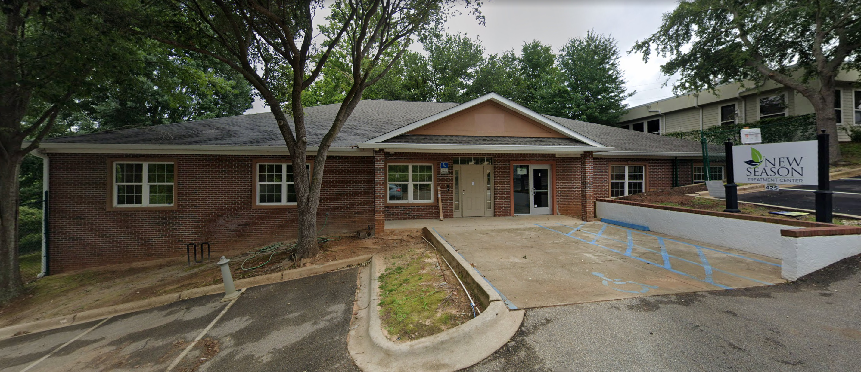 Facility exterior with signage and accessible parking.