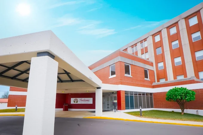 Covered entrance of modern brick rehab facility building