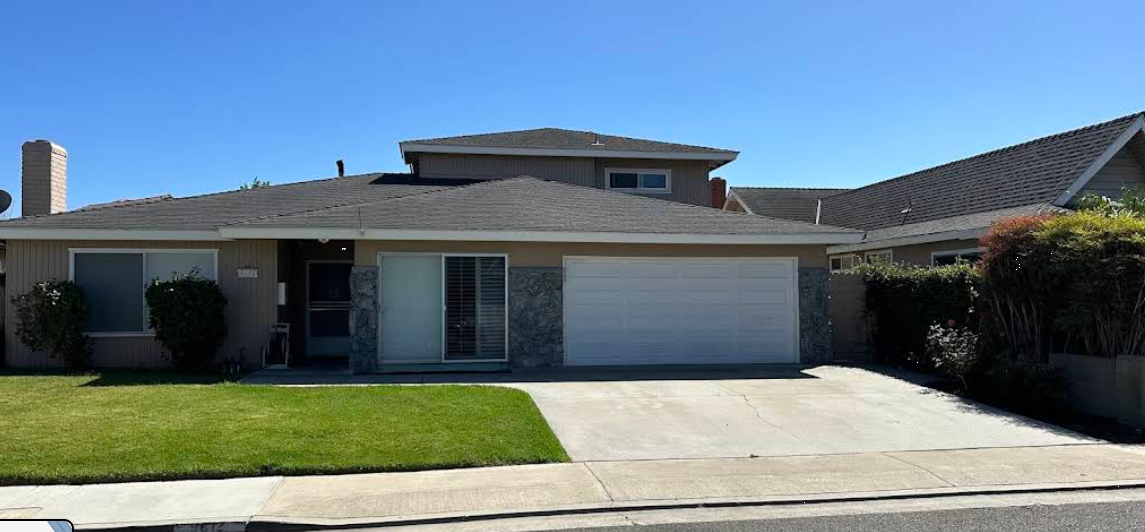 Modern two-story rehab facility with driveway and garage front