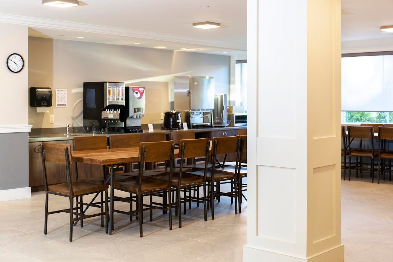 Cafeteria area with shared long tables and seating.