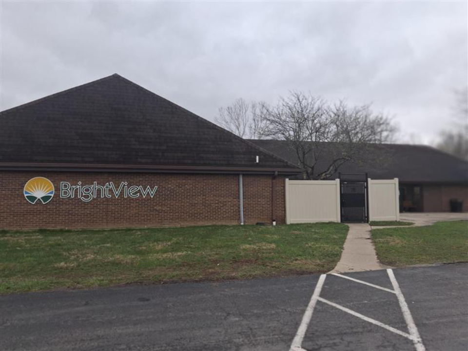 BrightView Health Batavia exterior with brick building, BrightView signage, walkway, and parking area
