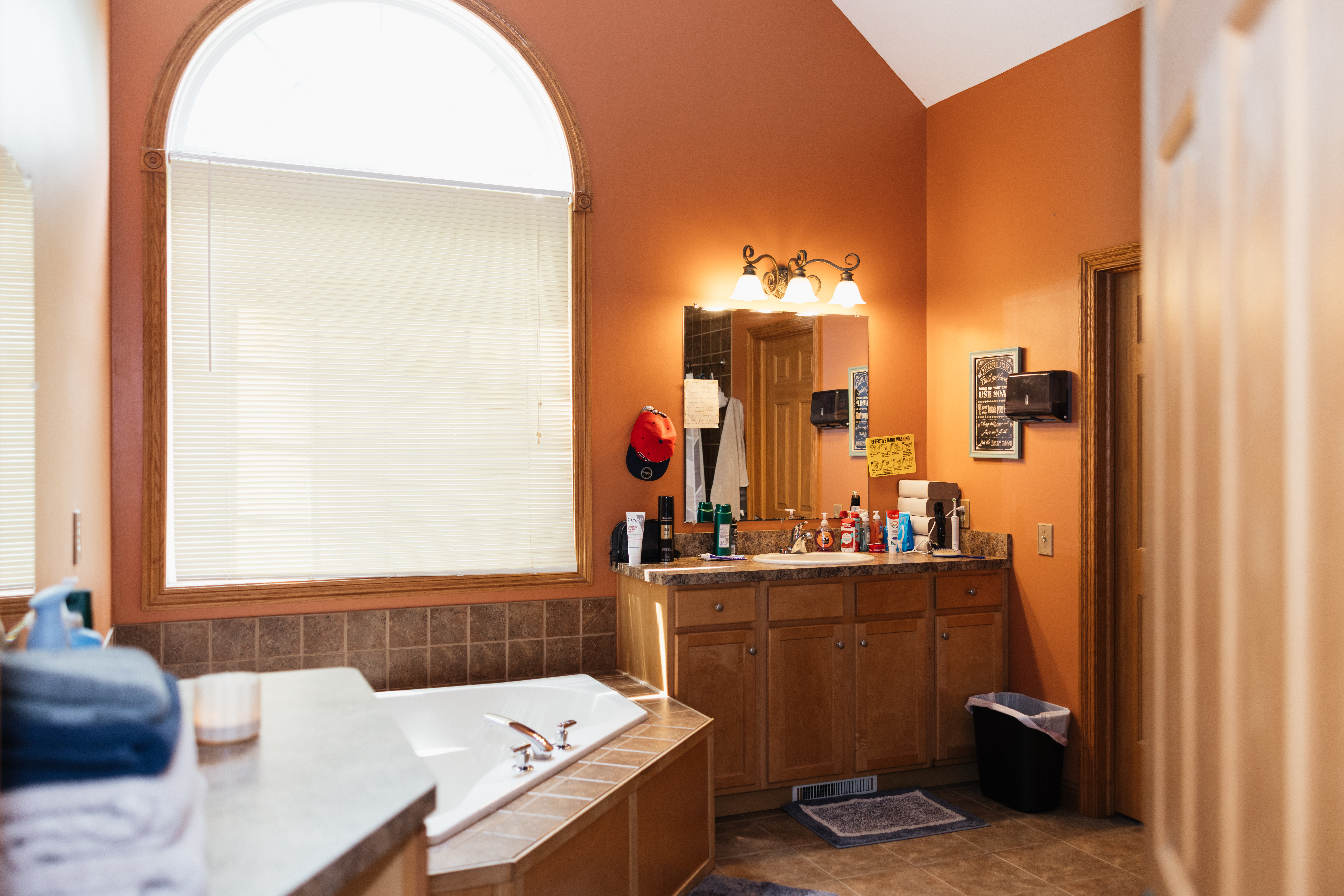 Bathroom featuring large bathtub and vanity
