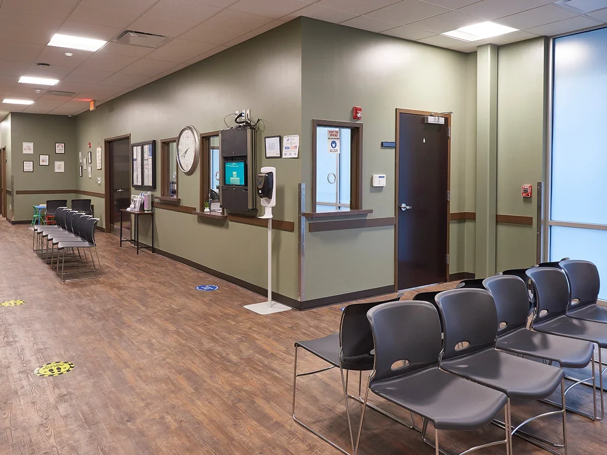 Hallway with chairs lined up for waiting patients