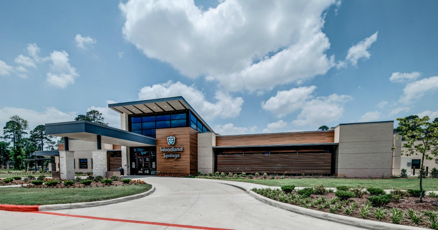 Hospital entrance with landscaping and sign