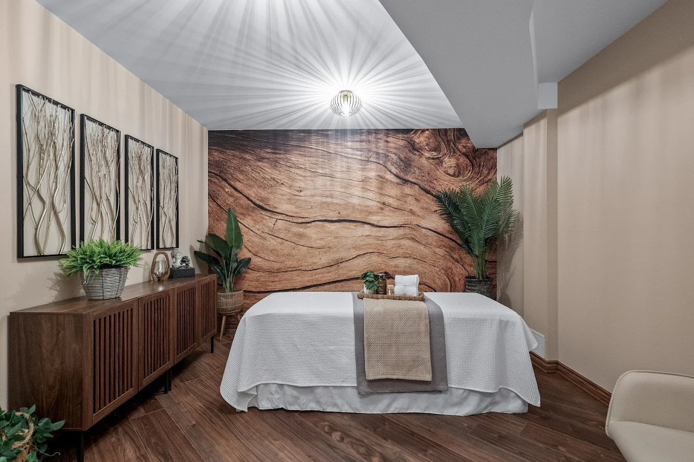 Massage table with natural wood decor and plants