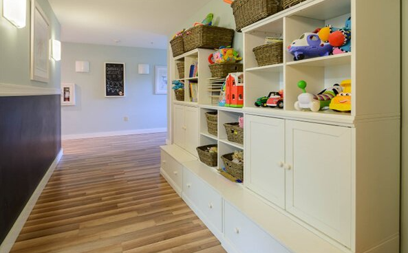 Indoor play area with toys and storage shelves