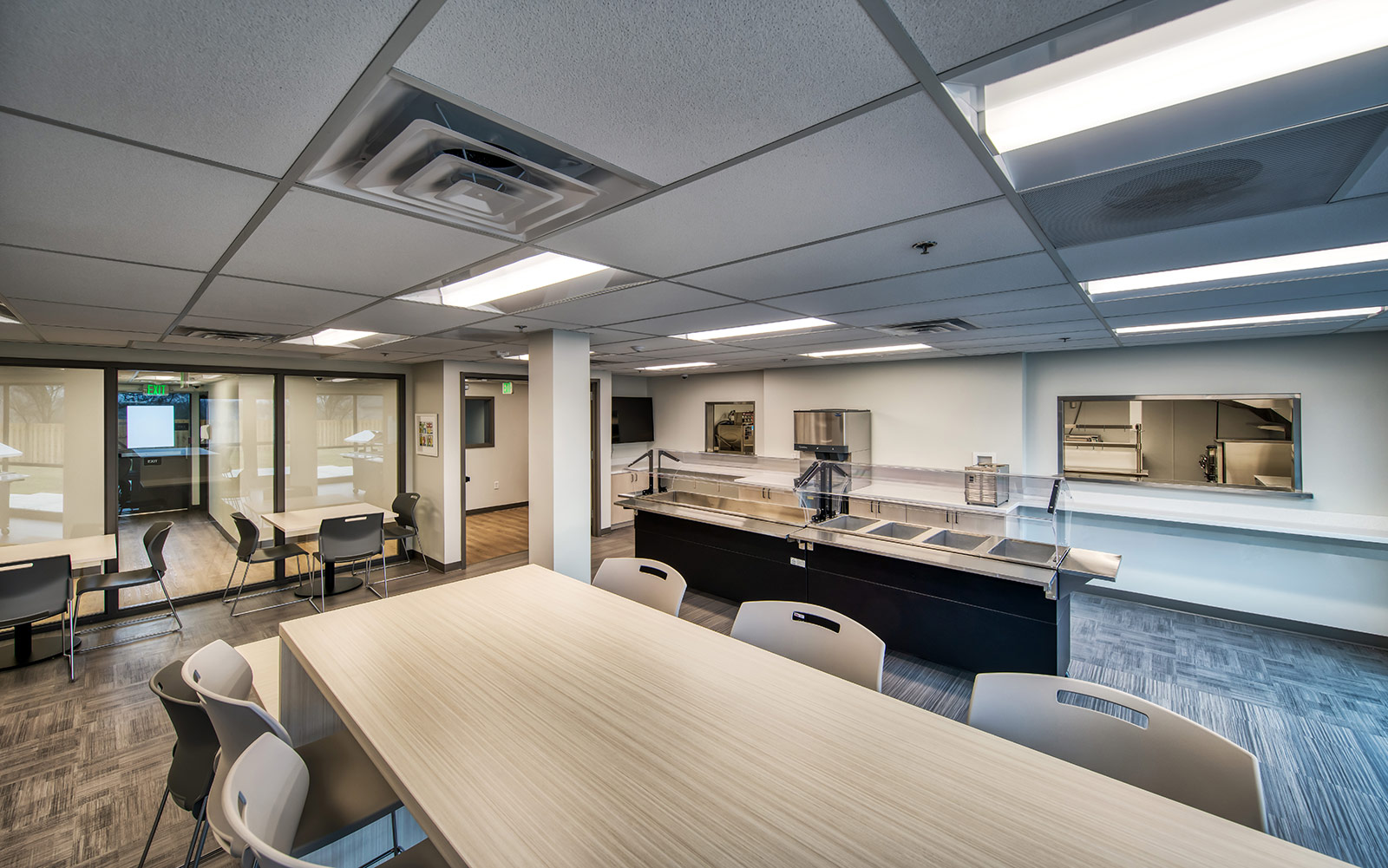 Modern cafeteria with serving counter and seating