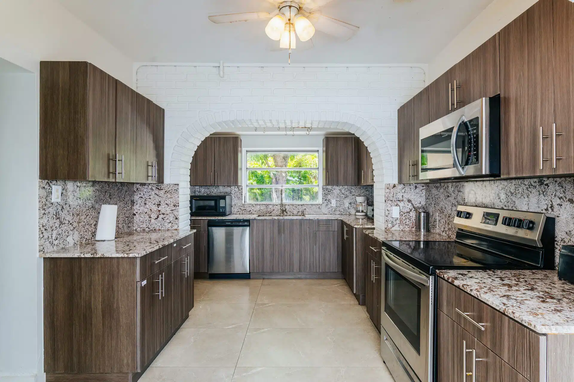 Spacious kitchen with wood cabinets and stainless steel appliances