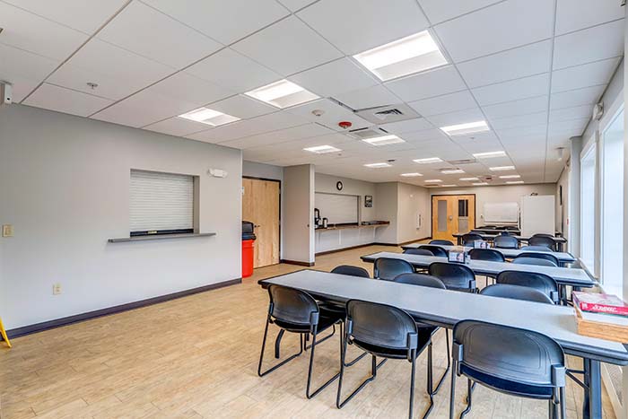 Bright dining room with long tables and windows