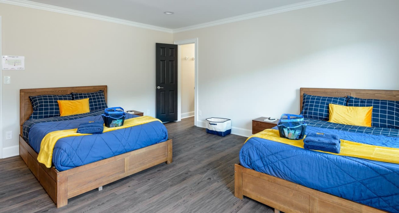 Shared bedroom with two beds.