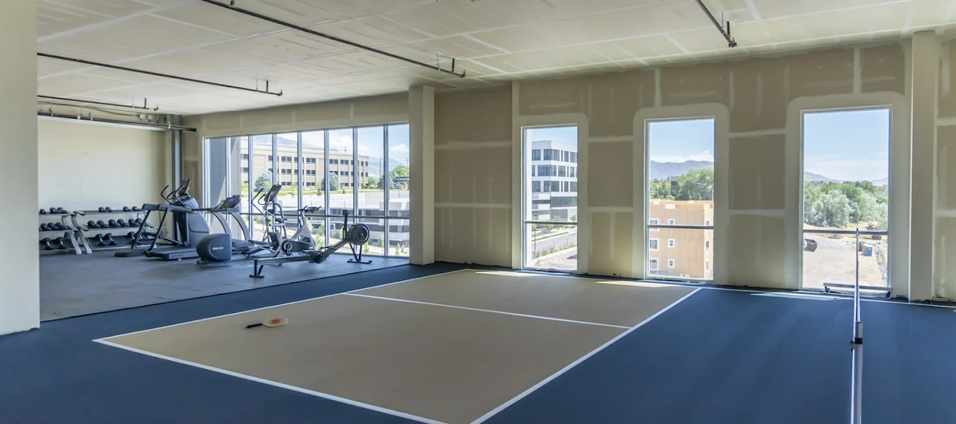 Gym with exercise equipment and indoor sports area