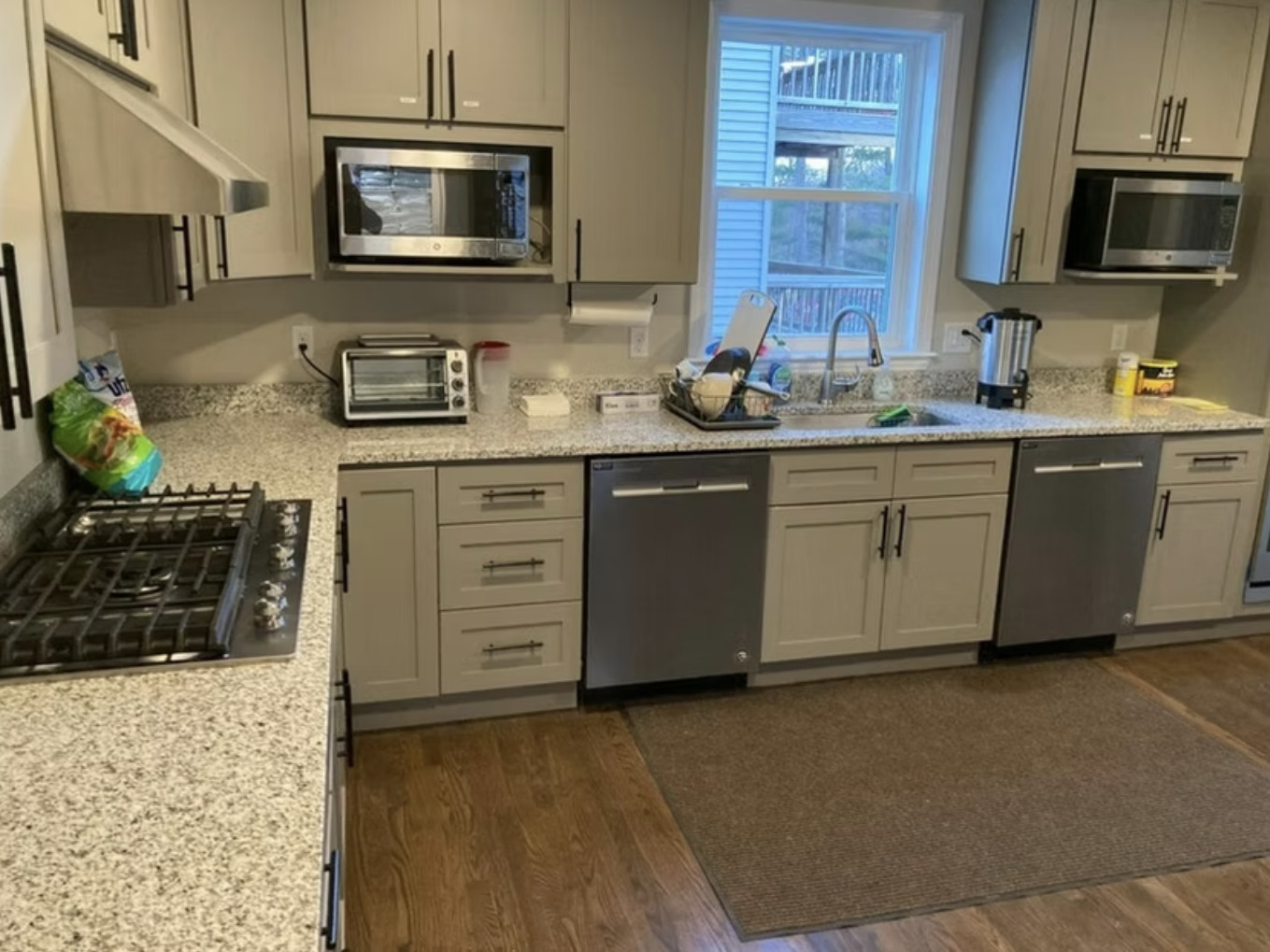 Modern kitchen with granite counters and gray cabinets