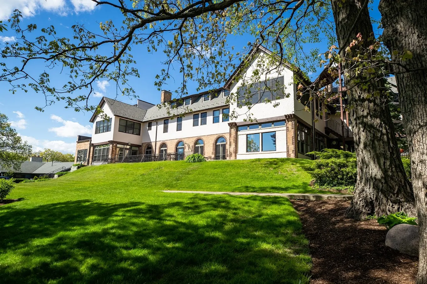 Exterior view of rehab facility with green lawn