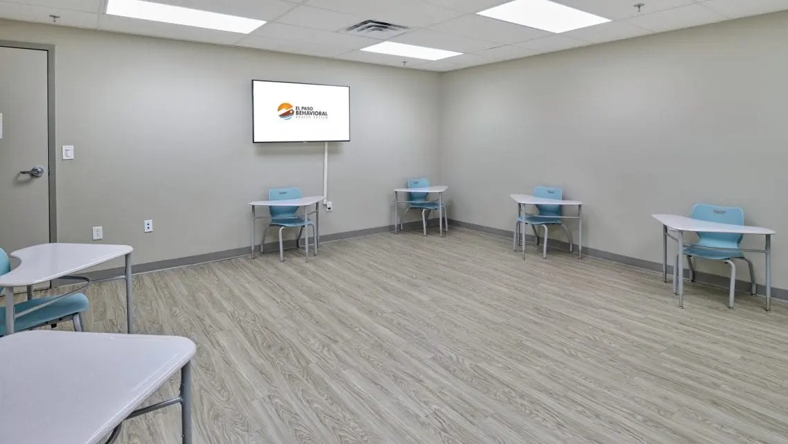 Classroom with individual desks and display screen