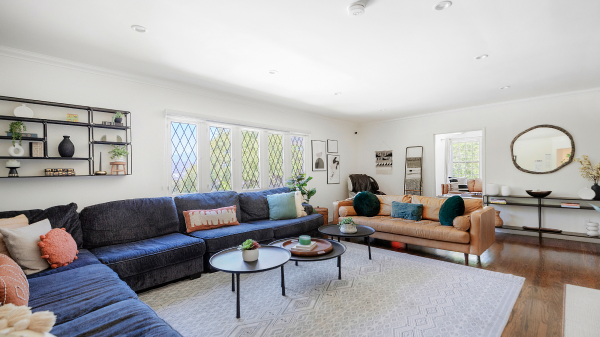 Bright lounge with large sectional sofa and natural light