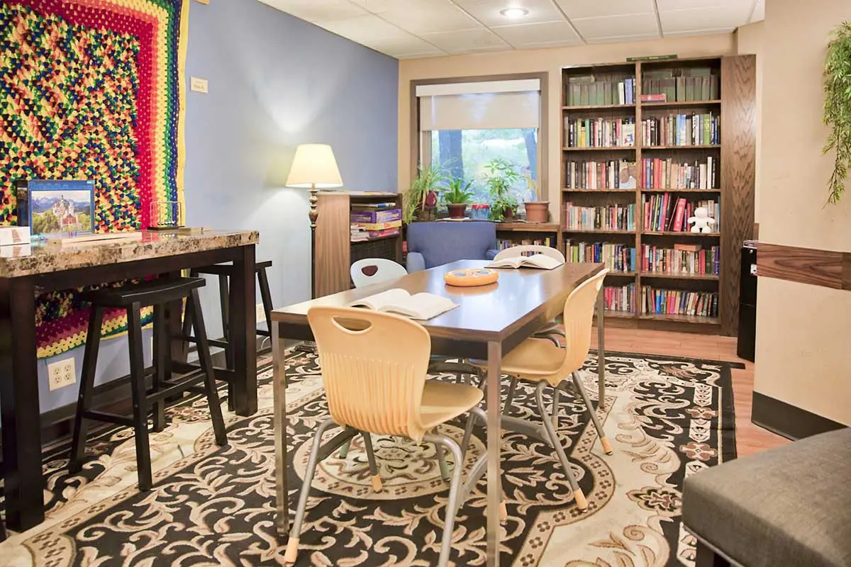 Library and reading area with bookshelves and tables