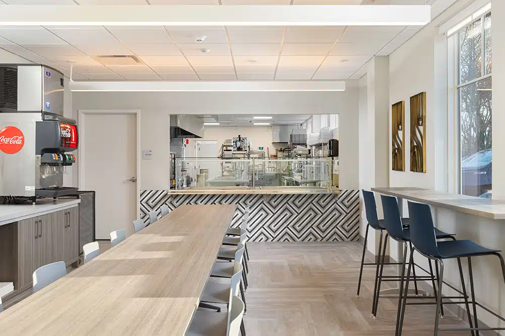 Modern dining area with drink stations and open kitchen