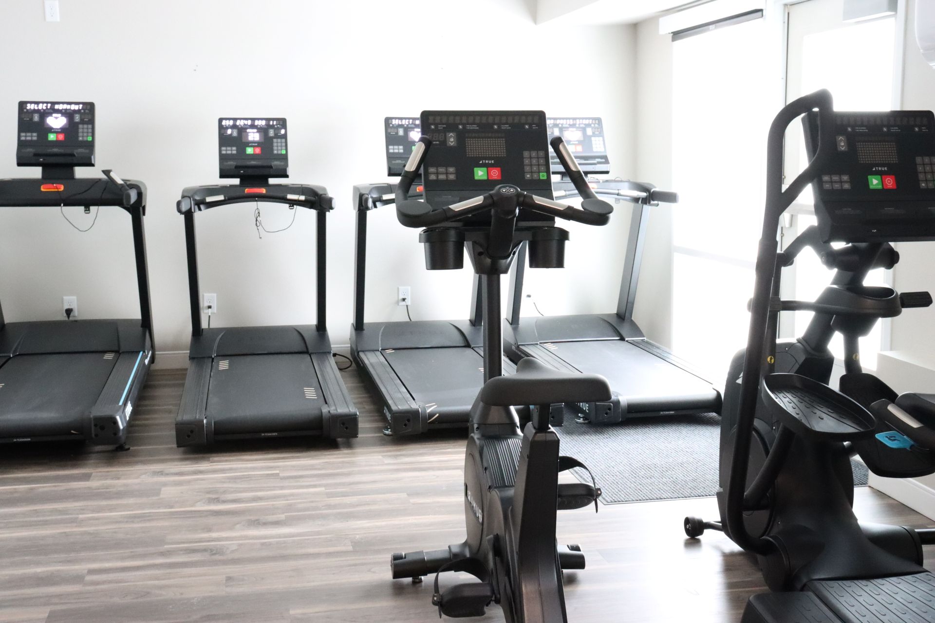 Cardio room with treadmills, and exercise bike