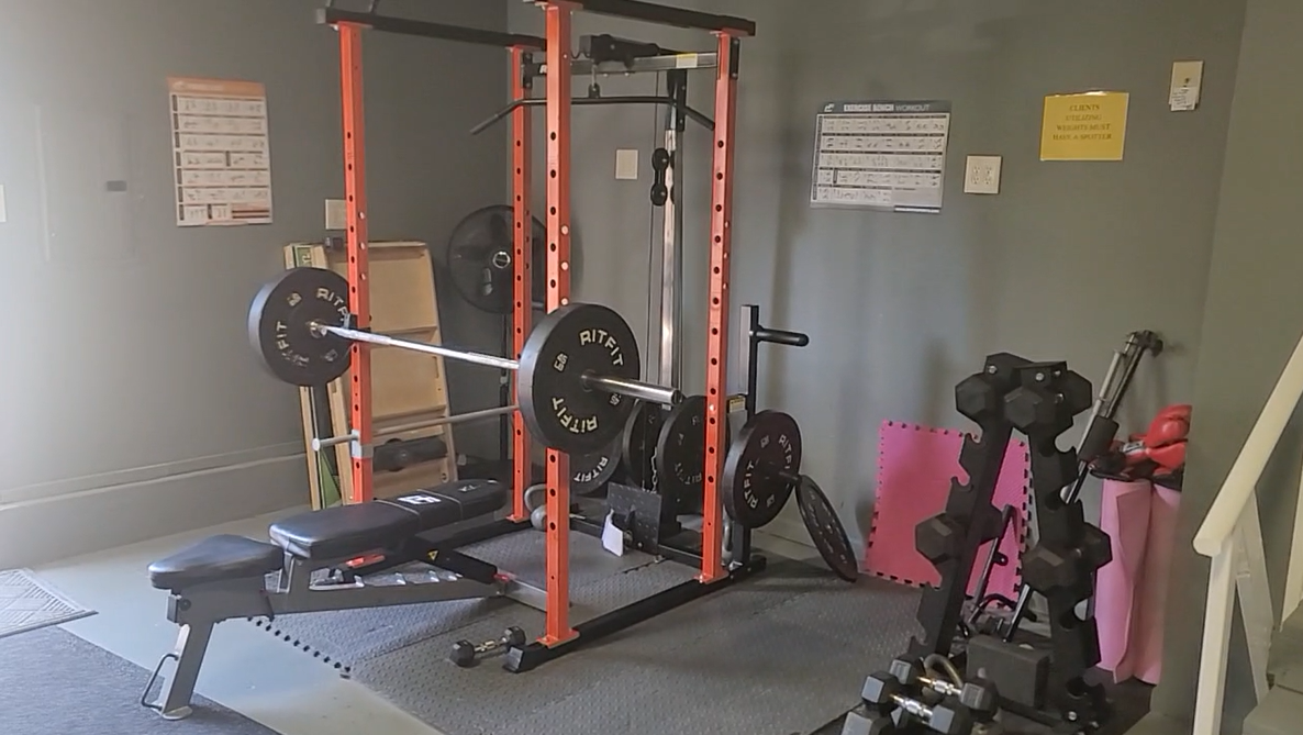 Home gym with weights and lifting equipment