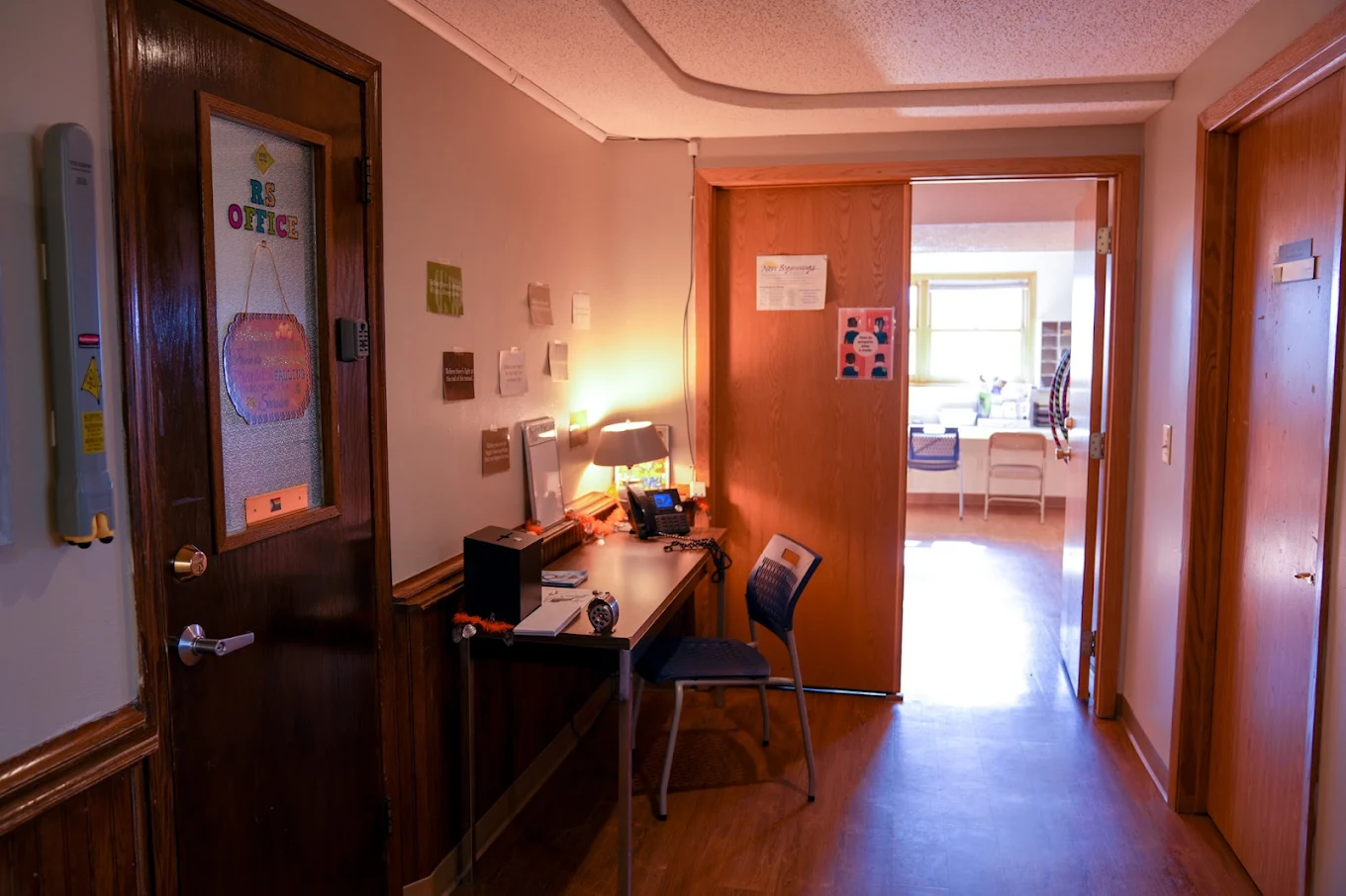 Small counseling office with desk and chair